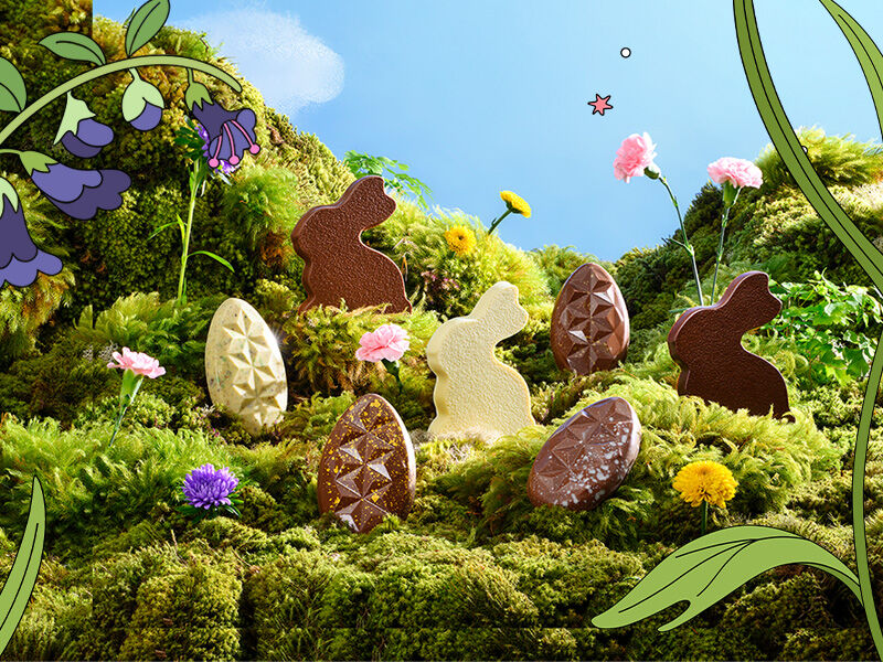 Ovos de Páscoa decorados coloridos em um campo florido.